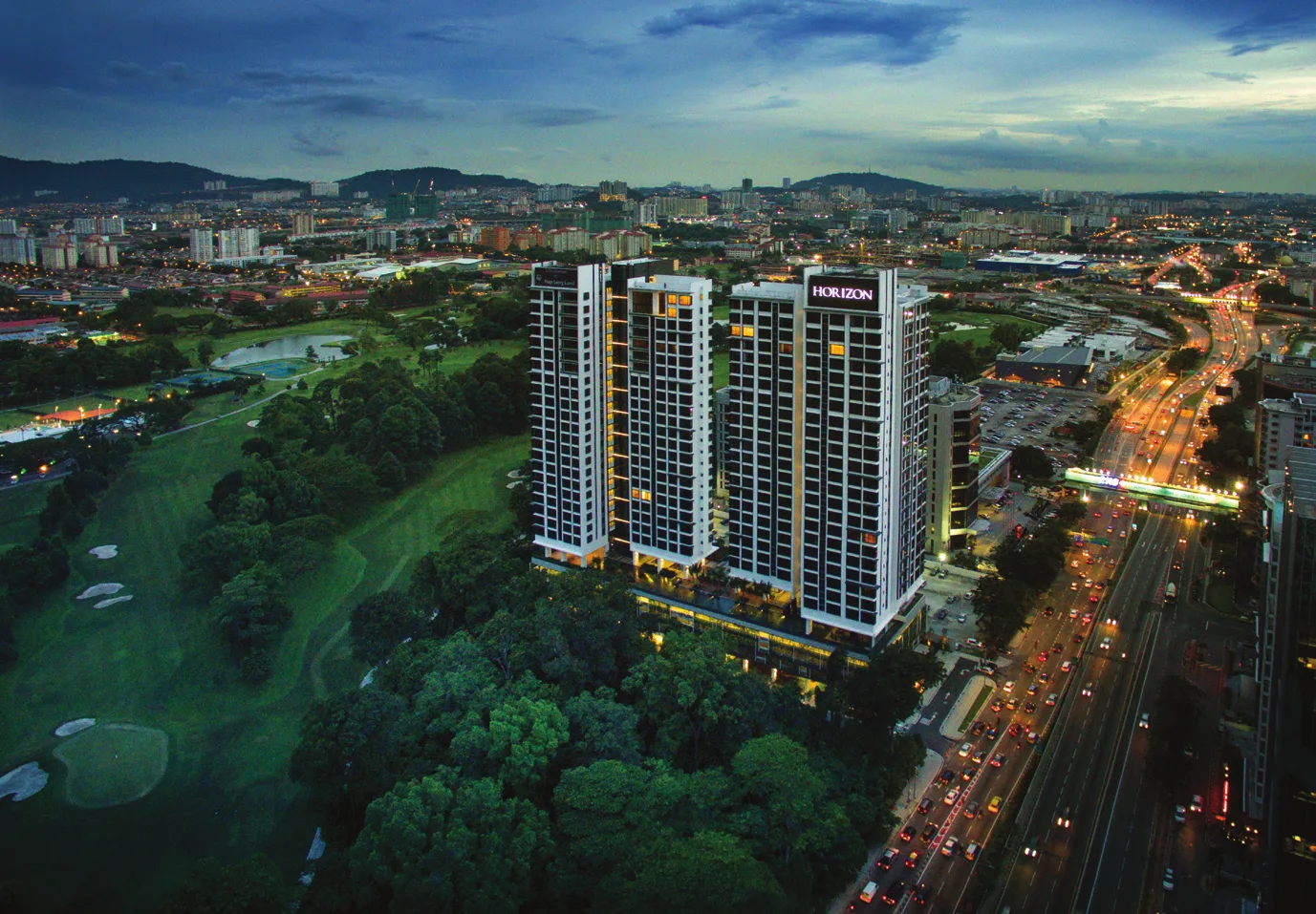 AKASA Cheras South towers at dusk with the Klang Valley skyline