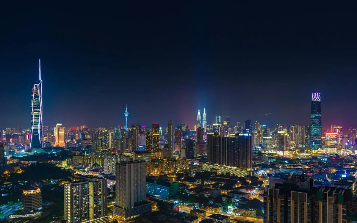 Kuala Lumpur skyline at night featuring Merdeka 118, near MABA Suitez